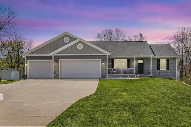 8308 E G Ave, Kalamazoo, MI 49048 - ranch-style home featuring roof with shingles, an attached garage, covered porch, a yard, and driveway