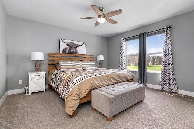 8308 E G Ave, Kalamazoo, MI 49048 - bedroom with a ceiling fan, baseboards, and carpet