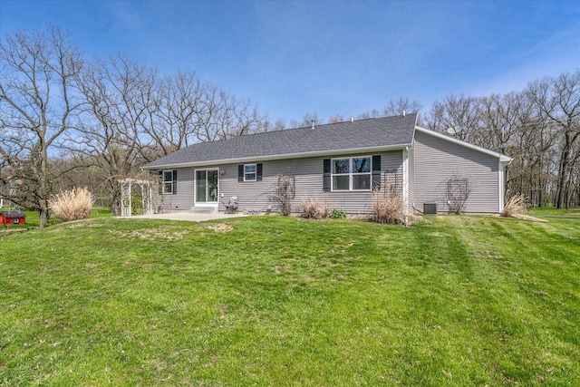 8308 E G Ave, Kalamazoo, MI 49048 - rear view of house featuring a patio area, central AC, and a yard