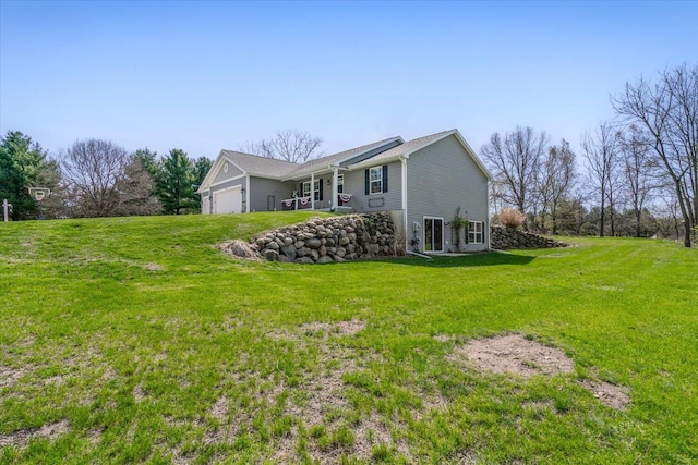 8308 E G Ave, Kalamazoo, MI 49048 - view of side of home with a yard and a garage