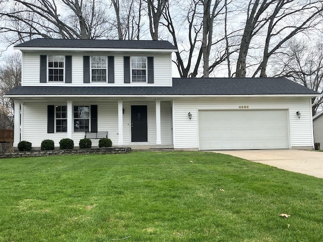 traditional-style home with a garage, a porch, driveway, and a front yard