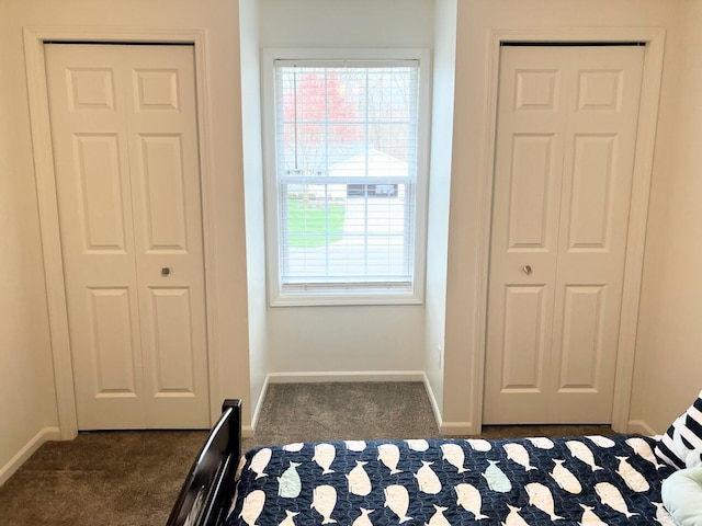 bedroom with carpet flooring and baseboards