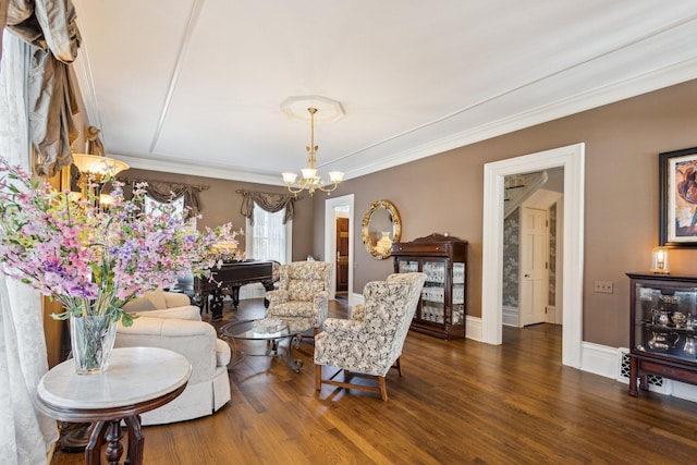 602 N Kalamazoo Ave, Marshall, MI 49068 - living area featuring a chandelier, ornamental molding, and dark wood-type flooring