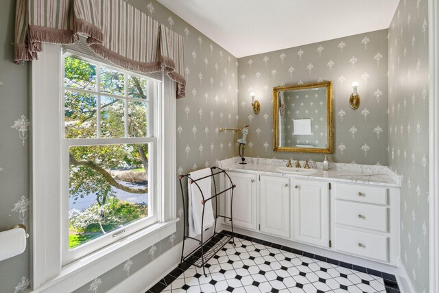 602 N Kalamazoo Ave, Marshall, MI 49068 - bathroom with wallpapered walls and vanity