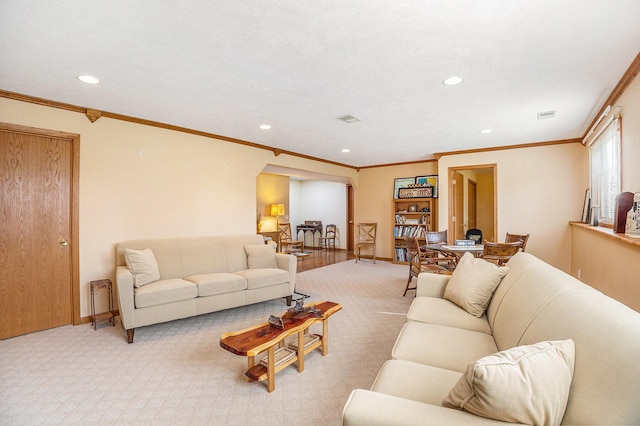 living area featuring recessed lighting, baseboards, light colored carpet, and ornamental molding