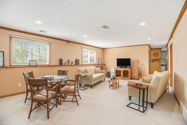 living area with ornamental molding, light carpet, and visible vents