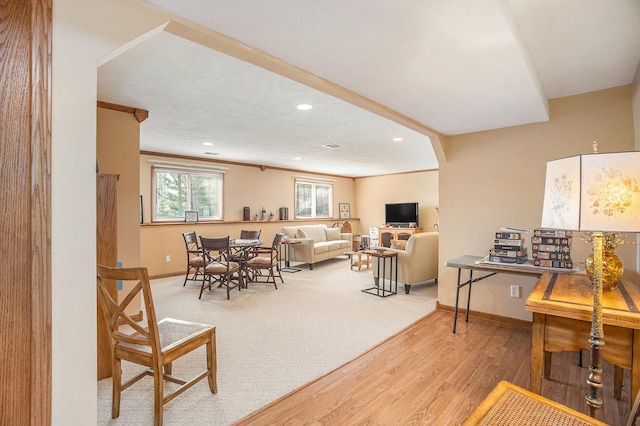 interior space featuring recessed lighting, baseboards, ornamental molding, and wood finished floors