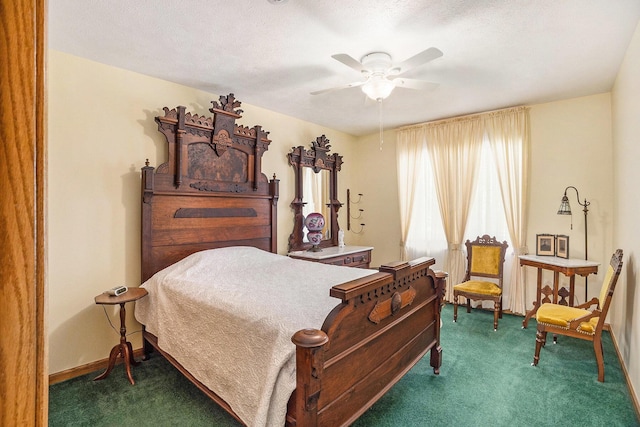 bedroom featuring dark carpet, baseboards, and ceiling fan