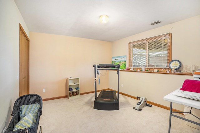 workout area featuring baseboards, carpet, and visible vents