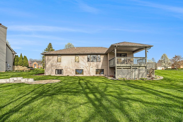 rear view of property with a lawn
