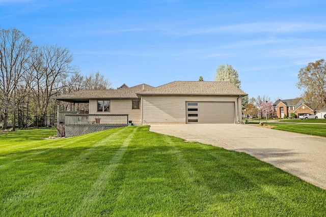 ranch-style house featuring an attached garage, a deck, concrete driveway, and a front lawn