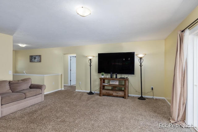living room with baseboards and carpet flooring