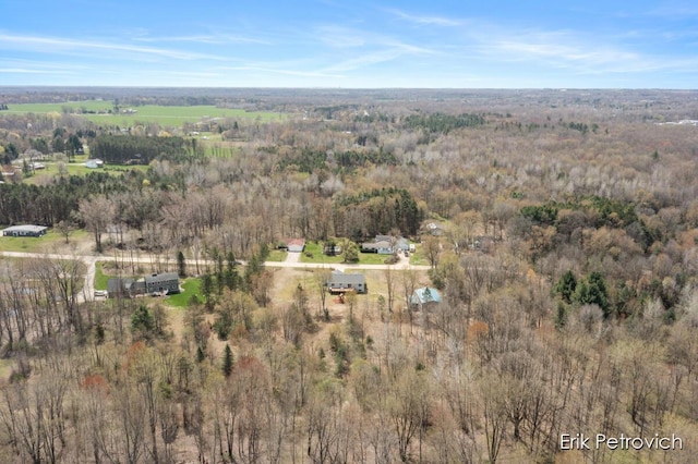 drone / aerial view featuring a view of trees