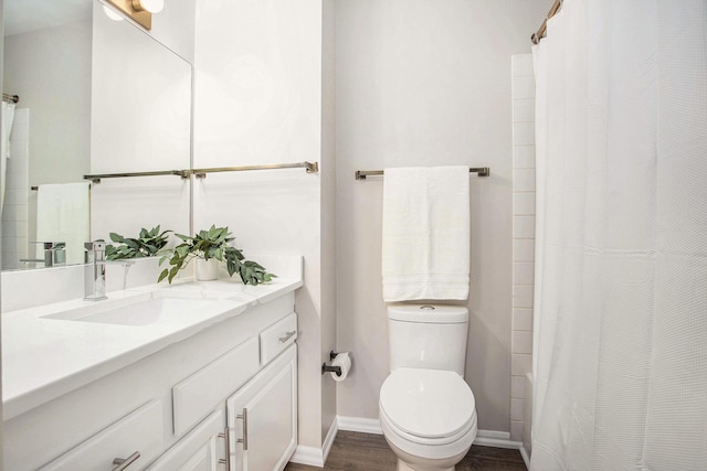full bathroom with wood finished floors, baseboards, vanity, toilet, and a shower with shower curtain