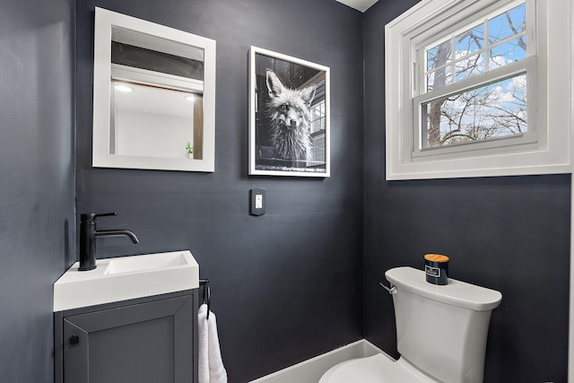 bathroom featuring toilet and vanity