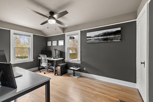 office with baseboards, ceiling fan, wood finished floors, and lofted ceiling