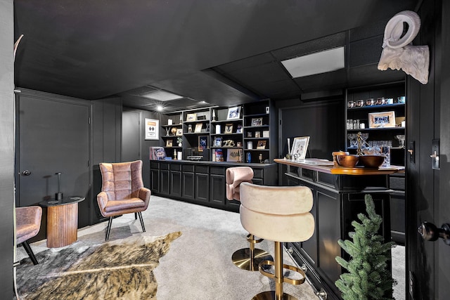 office space featuring carpet floors and a drop ceiling