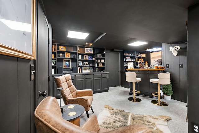 interior space with a dry bar and carpet