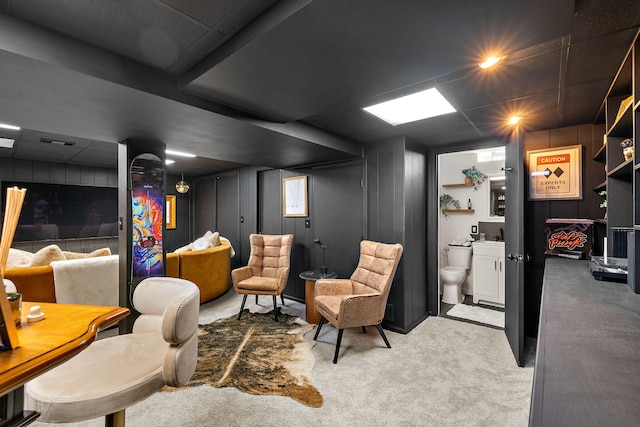 living area featuring carpet and visible vents