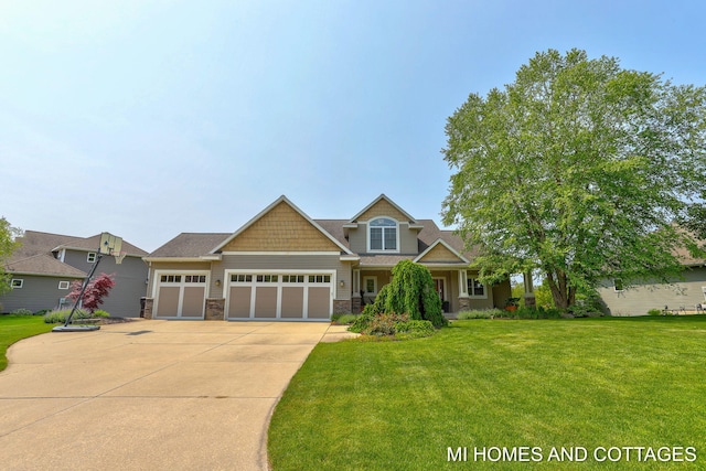 9145 Winterberry Dr, West Olive, MI 49460 - craftsman house with driveway, a garage, stone siding, and a front lawn