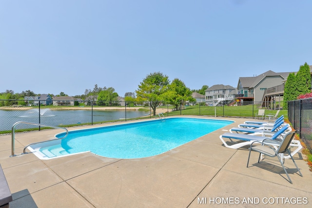 9145 Winterberry Dr, West Olive, MI 49460 - view of swimming pool featuring a patio, a residential view, and a water view