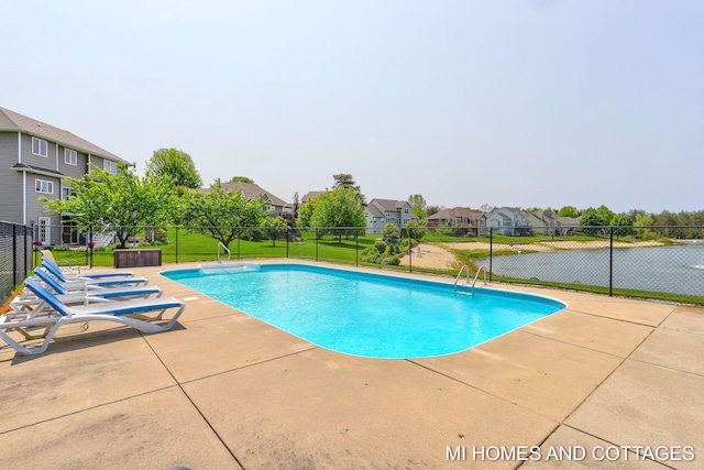 9145 Winterberry Dr, West Olive, MI 49460 - view of swimming pool featuring a patio area and a residential view