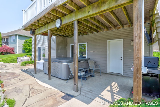9145 Winterberry Dr, West Olive, MI 49460 - view of patio featuring a hot tub
