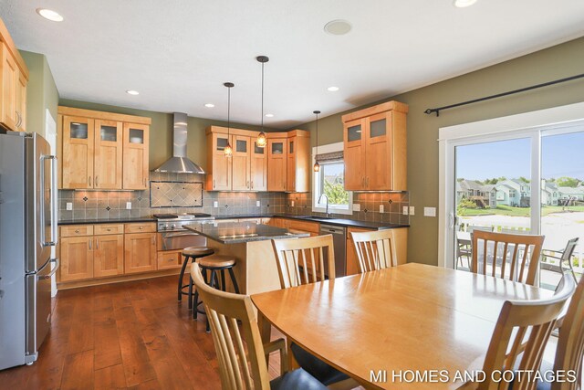 9145 Winterberry Dr, West Olive, MI 49460 - dining room featuring dark wood-style flooring and recessed lighting