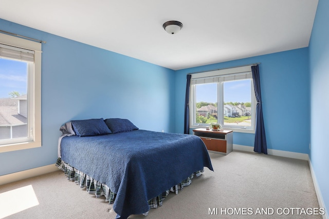 9145 Winterberry Dr, West Olive, MI 49460 - carpeted bedroom with baseboards