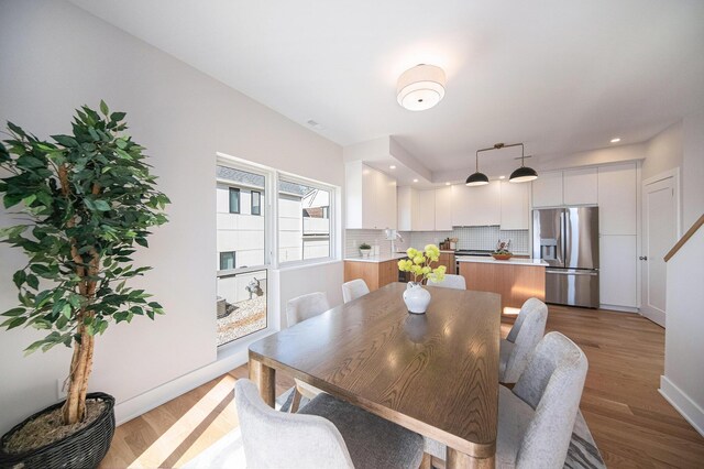 205 Sunset Rd, Ann Arbor, MI 48103 - dining room featuring baseboards and wood finished floors