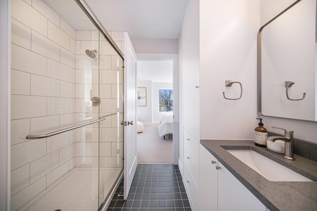 205 Sunset Rd, Ann Arbor, MI 48103 - ensuite bathroom with vanity, ensuite bathroom, tile patterned flooring, and a stall shower