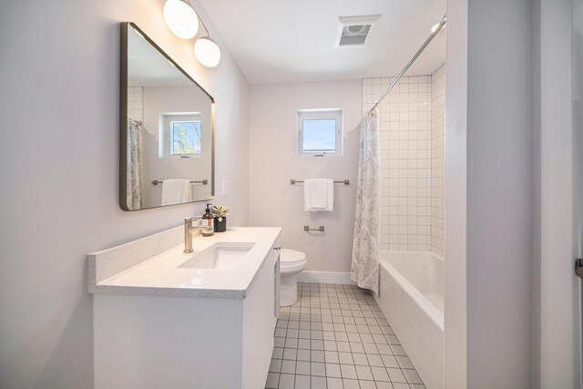 205 Sunset Rd, Ann Arbor, MI 48103 - full bathroom with tile patterned flooring, vanity, toilet, baseboards, and visible vents
