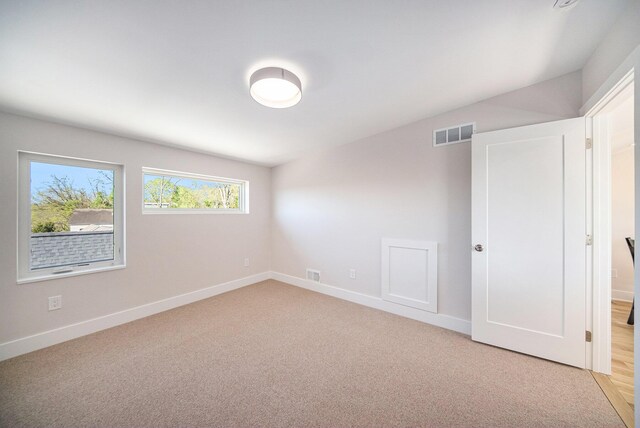 205 Sunset Rd, Ann Arbor, MI 48103 - empty room featuring baseboards, light carpet, and visible vents