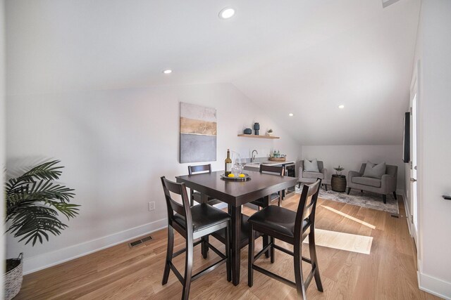 205 Sunset Rd, Ann Arbor, MI 48103 - dining room featuring visible vents, light wood-type flooring, baseboards, lofted ceiling, and recessed lighting