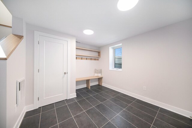 205 Sunset Rd, Ann Arbor, MI 48103 - mudroom featuring dark tile patterned flooring, baseboards, and visible vents