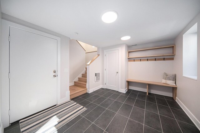 205 Sunset Rd, Ann Arbor, MI 48103 - mudroom featuring dark tile patterned flooring, baseboards, and visible vents