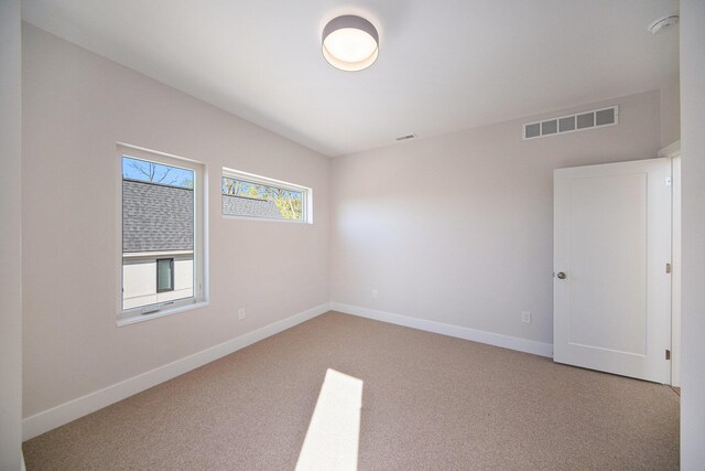 205 Sunset Rd, Ann Arbor, MI 48103 - empty room featuring light colored carpet, baseboards, and visible vents