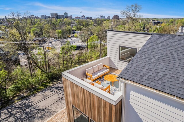 205 Sunset Rd, Ann Arbor, MI 48103 - details featuring roof with shingles and a view of city
