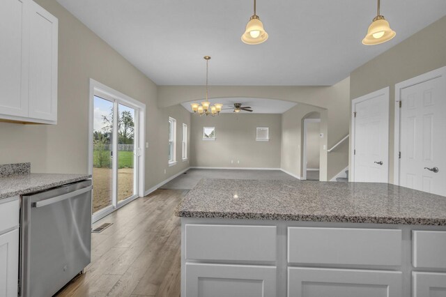 kitchen featuring white cabinetry, light wood finished floors, ceiling fan with notable chandelier, dishwasher, and decorative light fixtures