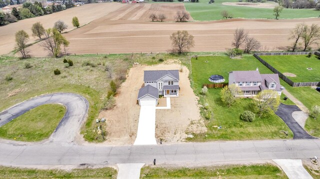 birds eye view of property featuring a rural view