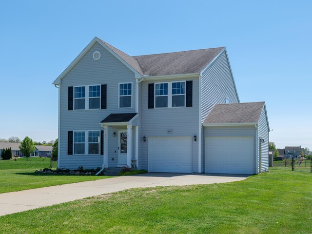 30777 Packard St, Paw Paw, MI 49079 - view of front facade featuring concrete driveway, a front lawn, and a garage