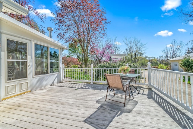deck with outdoor dining space