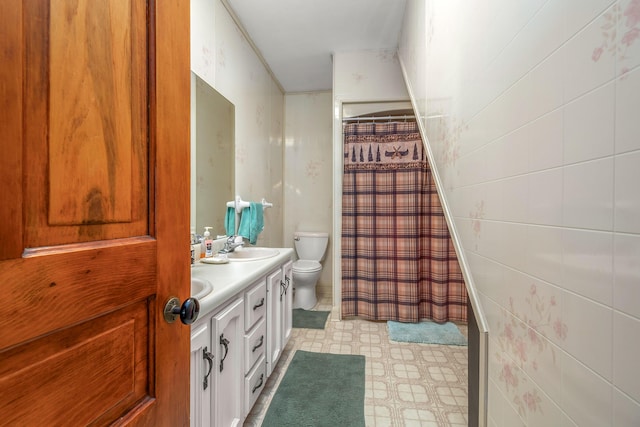 bathroom featuring a sink, toilet, double vanity, tile patterned floors, and a shower with shower curtain