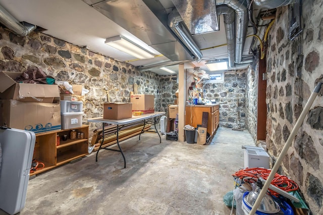 unfinished below grade area featuring a workshop area