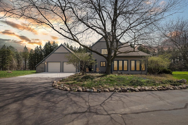 view of front of property featuring a garage and driveway