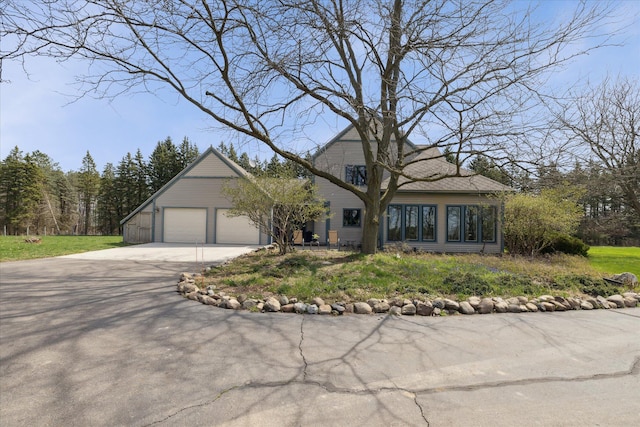 view of front of home featuring an attached garage and concrete driveway