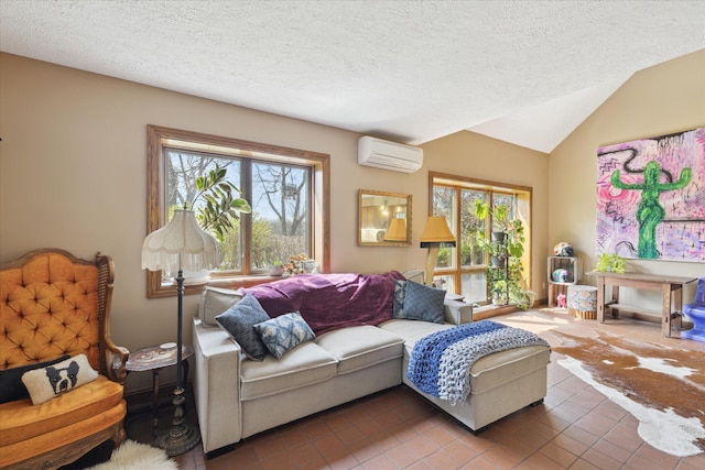 living room with tile patterned flooring, a wall mounted air conditioner, a textured ceiling, and a wealth of natural light