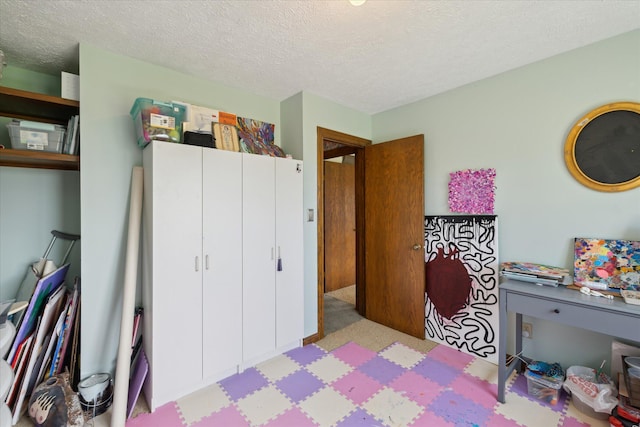 bedroom featuring a textured ceiling