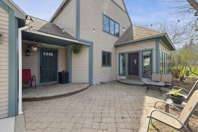 view of patio / terrace with a sunroom