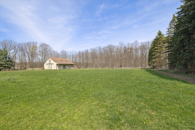view of yard with a wooded view